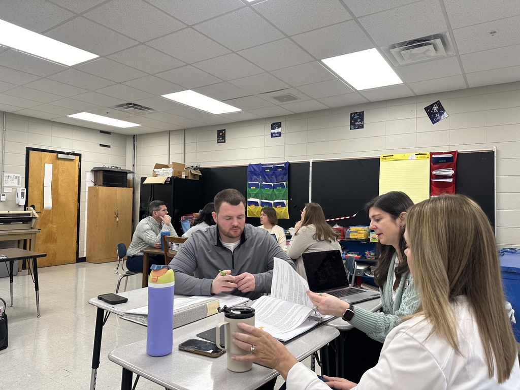 Staff reviewing due process folders with KEDC consultants