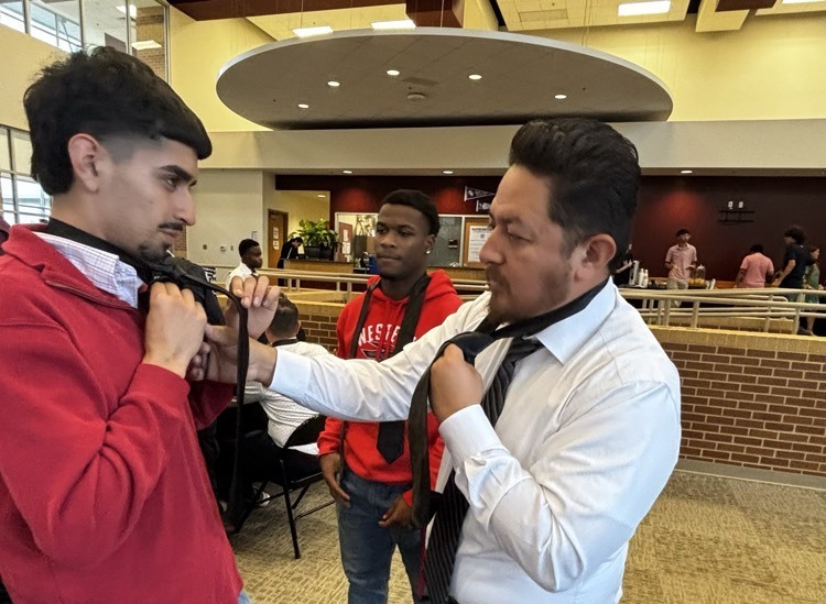 gentlemen tying ties 