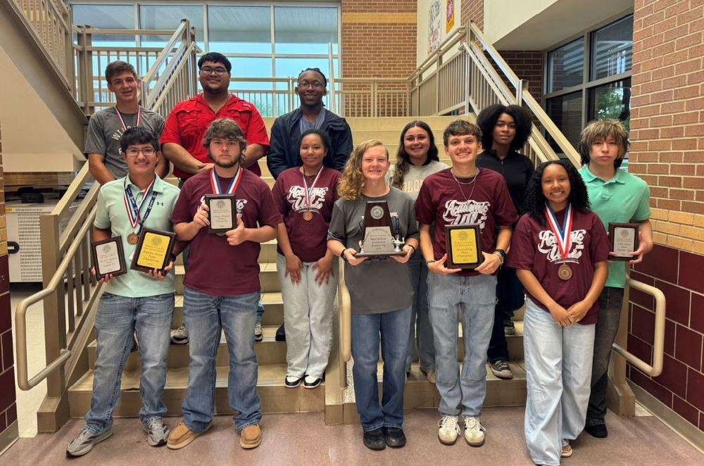 13 teenagers on stairs in two rows holding awards