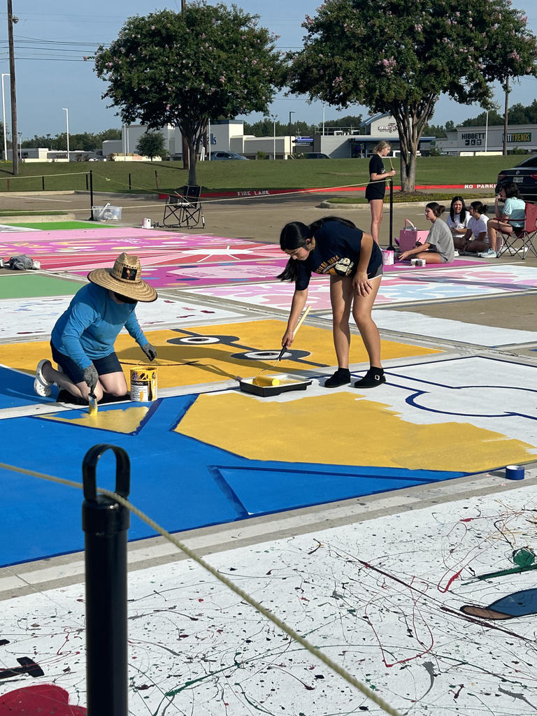 senior students at PHS painting their parking spaces