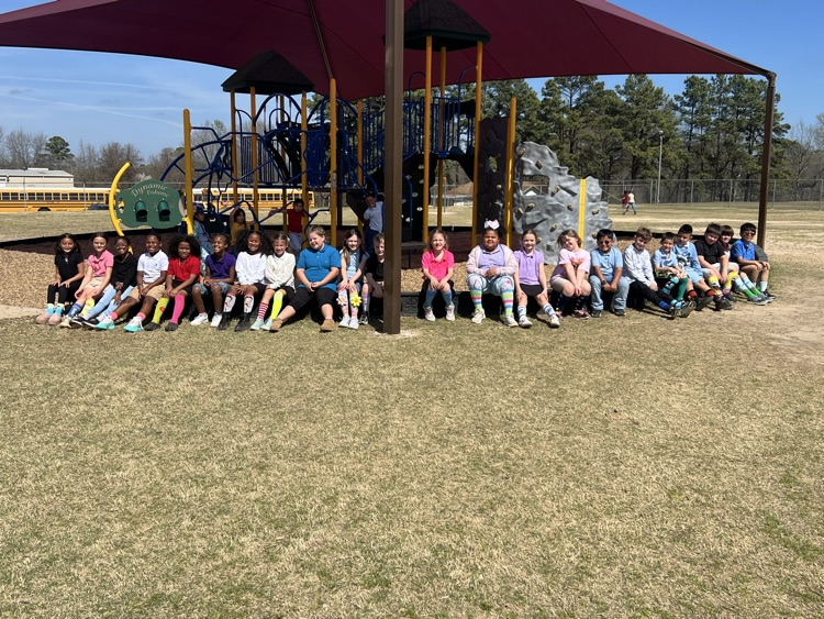 students out side under an awning 