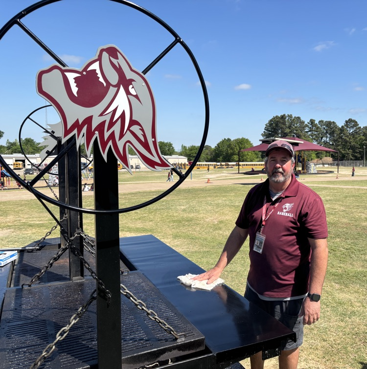man cleaning grill