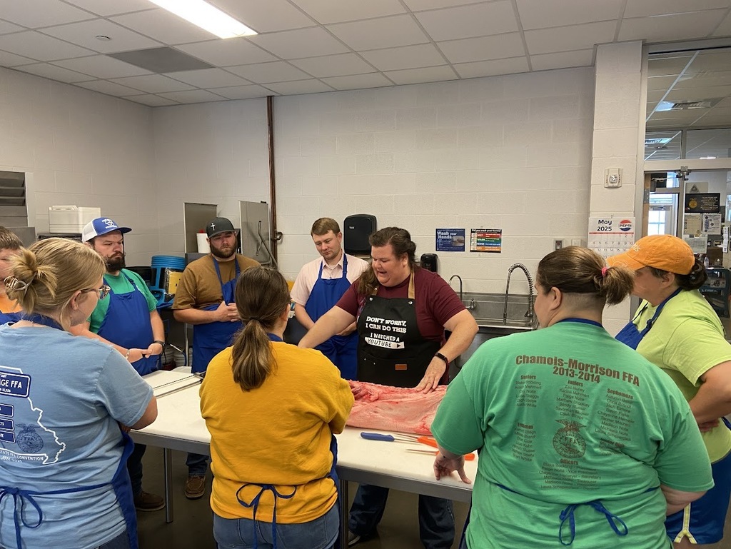 Ag teachers learning how to debone a pig