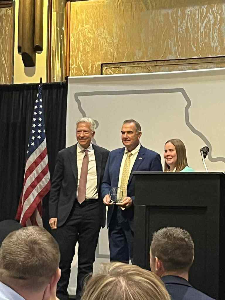 Kaitlyn Hopke with Governor Mike Kehoe