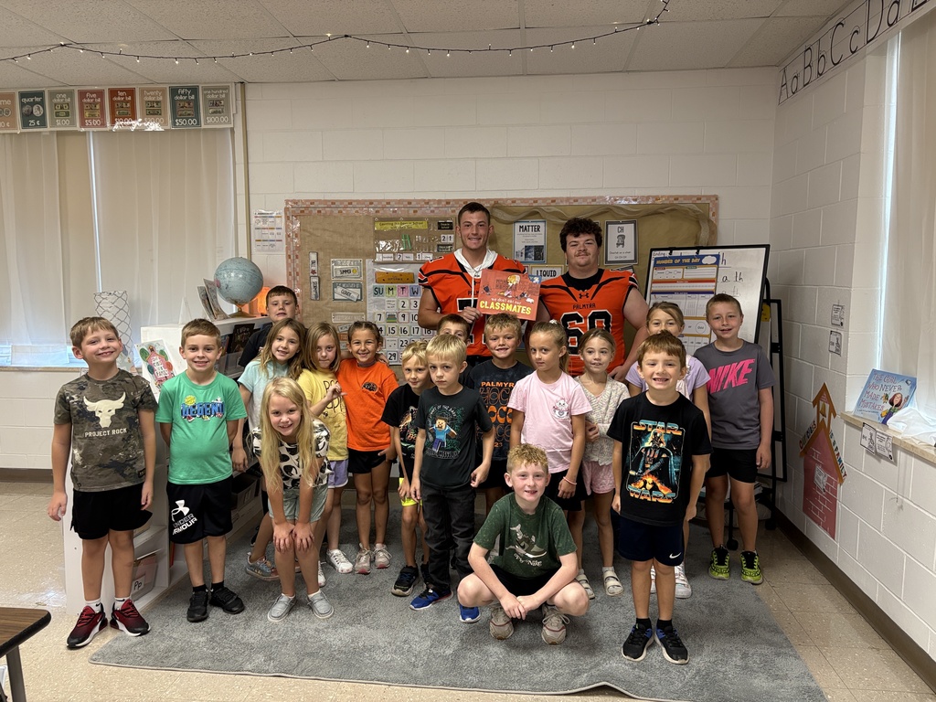 Football reading to the Panther classes
