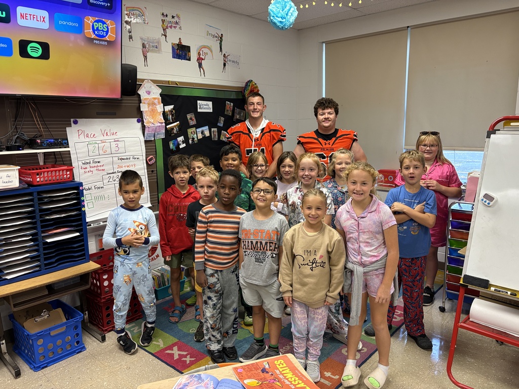 Football reading to the Panther classes