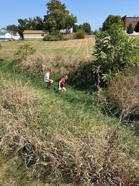 PACE class exploring the creek at middle school