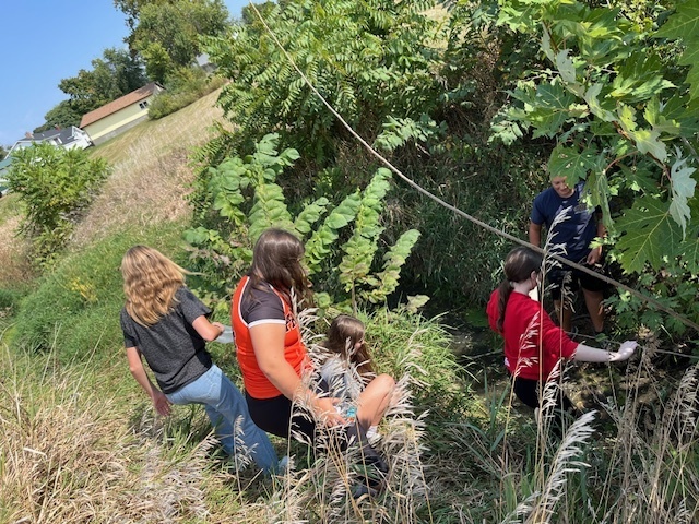 PACE class exploring the creek at middle school