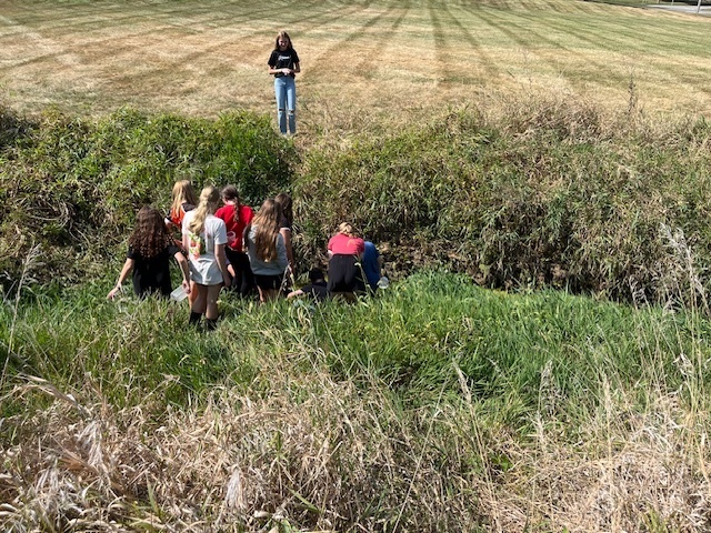 PACE class exploring the creek at middle school