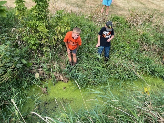 PACE class exploring the creek at middle school