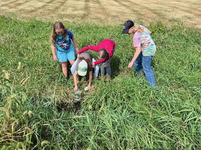 PACE class exploring the creek at middle school