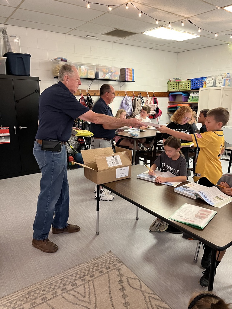 Kiwanis handing out dictionaries in 3rd grade
