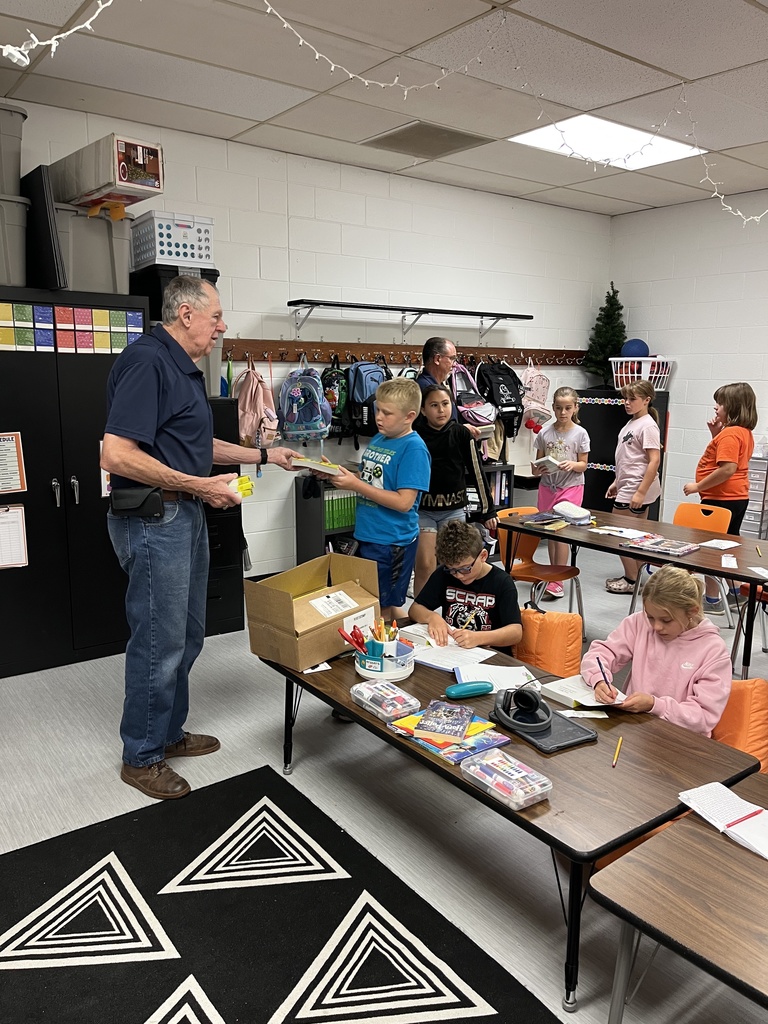 Kiwanis handing out dictionaries in 3rd grade