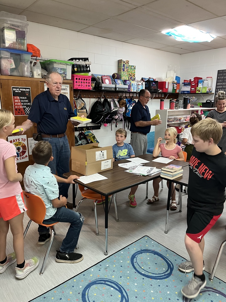 Kiwanis handing out dictionaries in 3rd grade