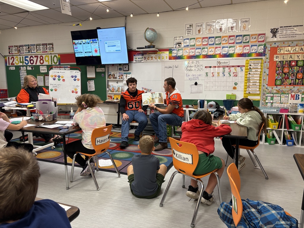 Football players read to 3rd grade class at PES