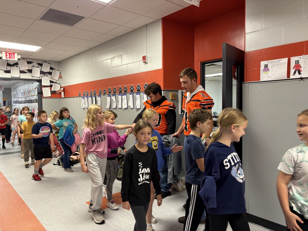 Football players greet kids at PES