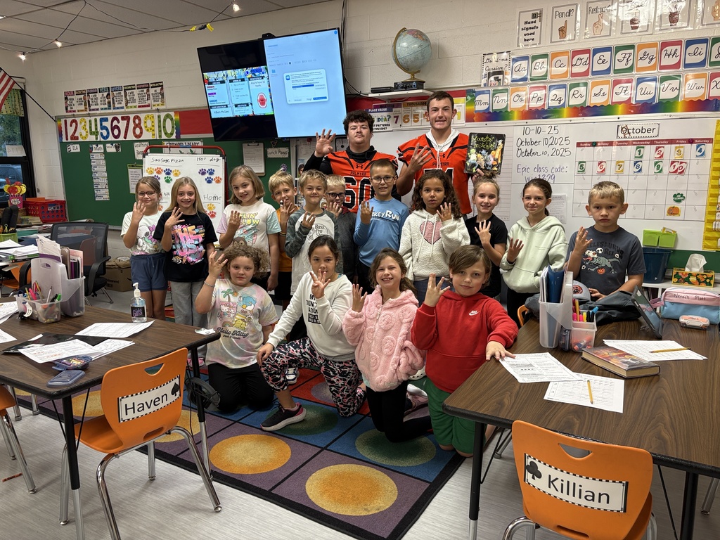 Football players read to 3rd grade class at PES