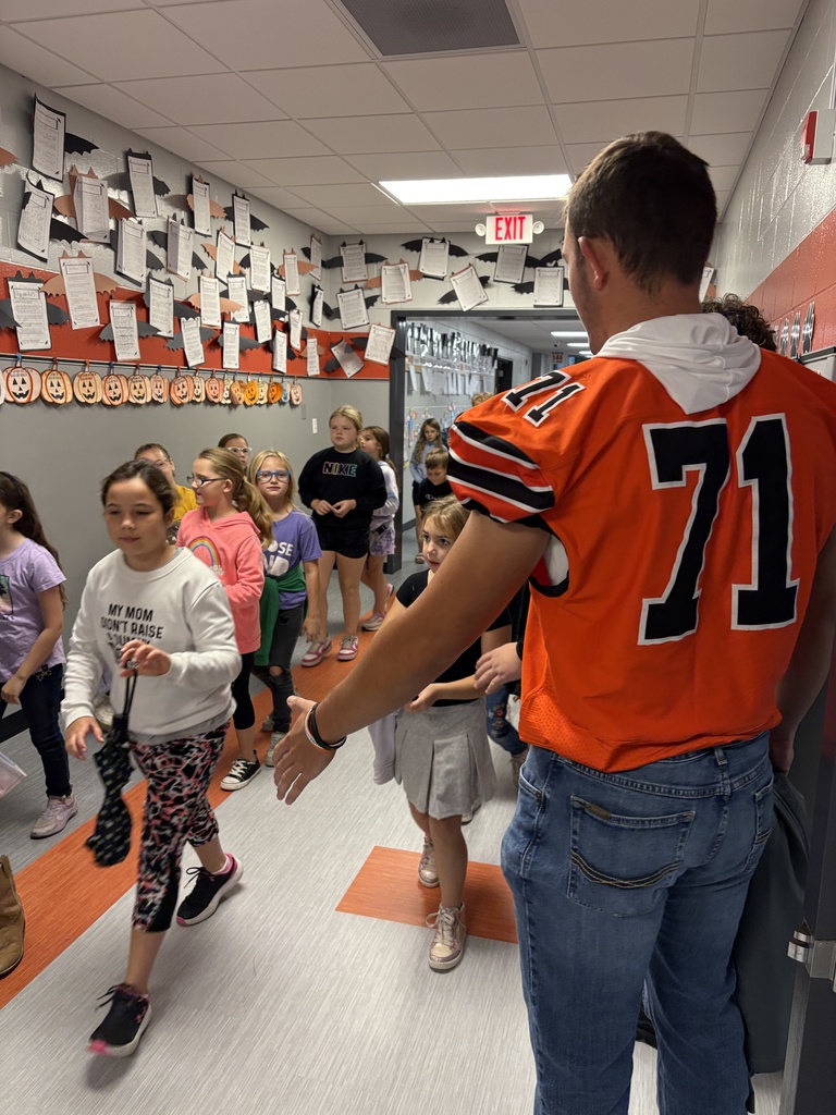 Football players greet kids at PES