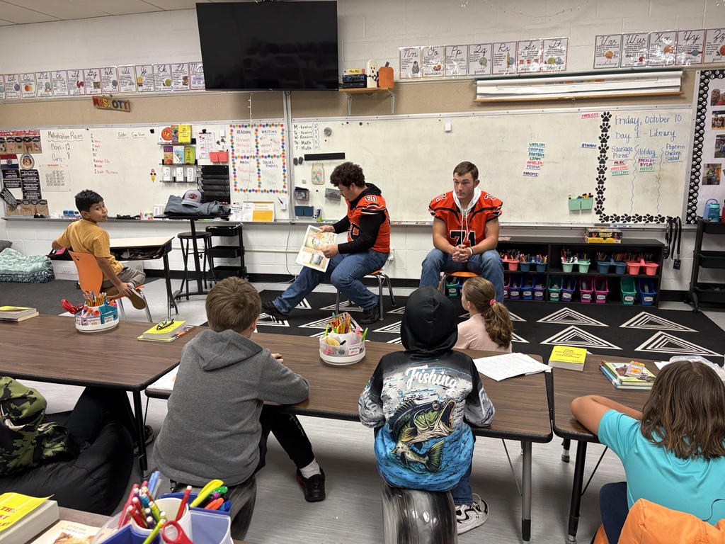 Football players read to 3rd grade class at PES
