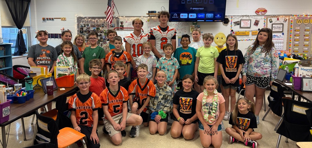 Football reads to ES classrooms