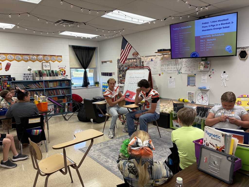 Football reads to ES classrooms