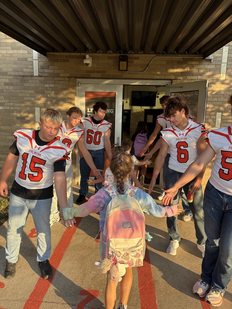 Football greeting kids at PES morning dropoff