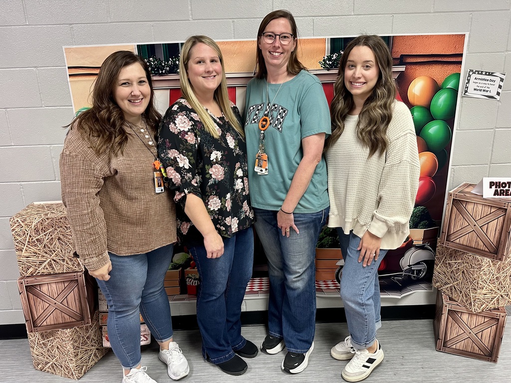 1st grade staff  at open house showing off their projects