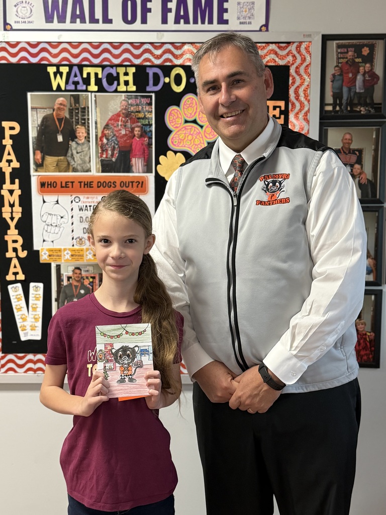 Zyler and Mr Harper with annual Christmas card winning entry