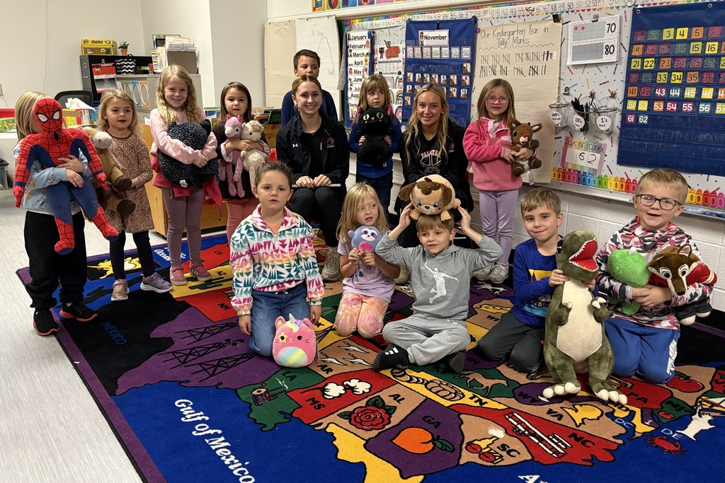 PHS baskeball reads to students at PES