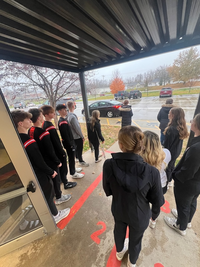 PHS baskeball at morning drop off with students at PES