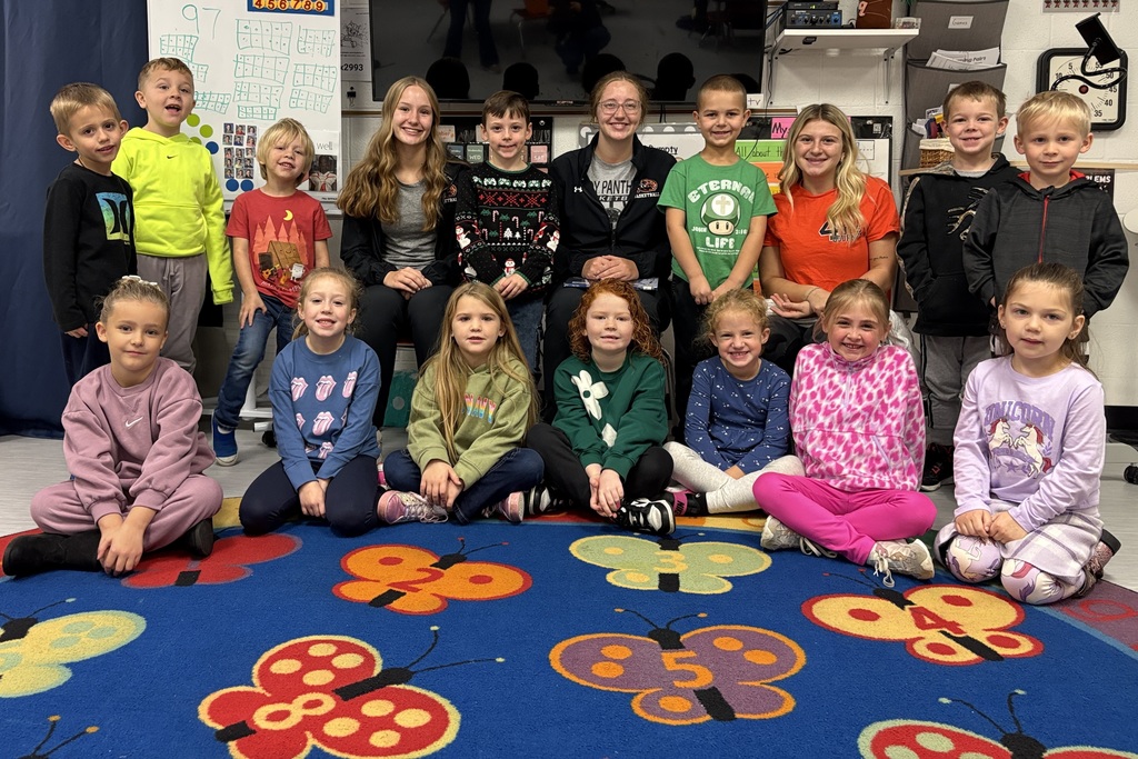 PHS baskeball reads to students at PES