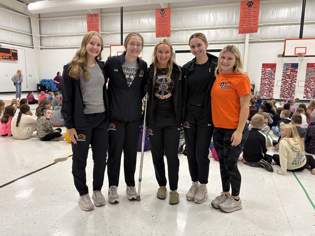 PHS baskeball in morning assembly with students at PES