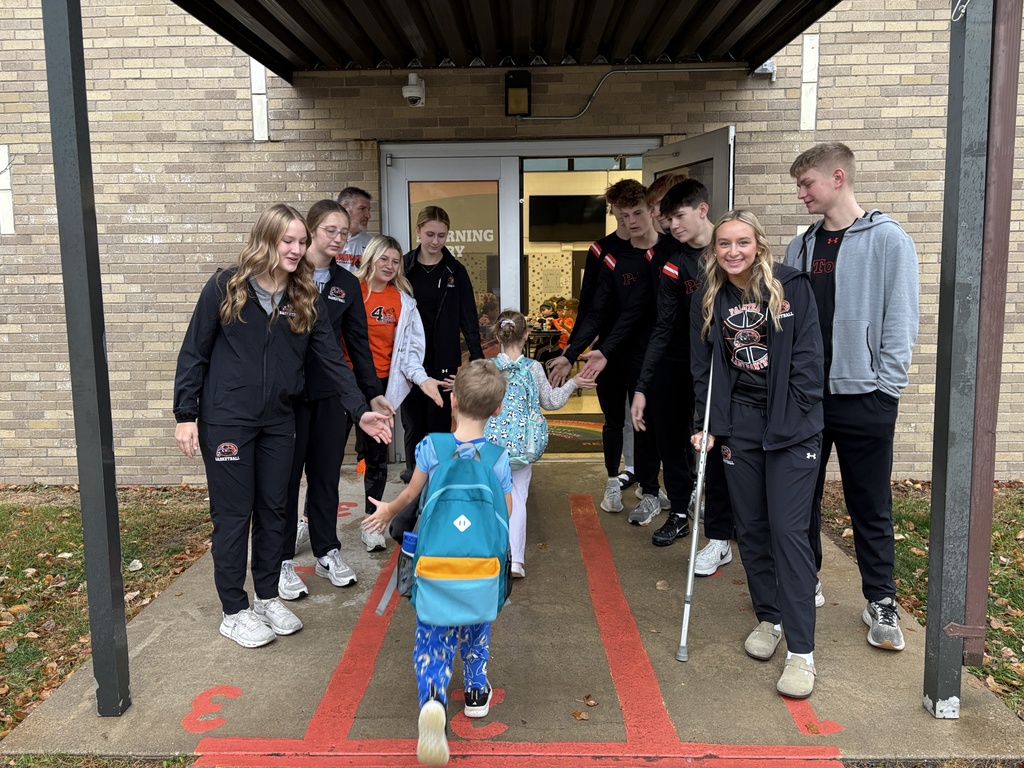 PHS baskeball at morning drop off with students at PES