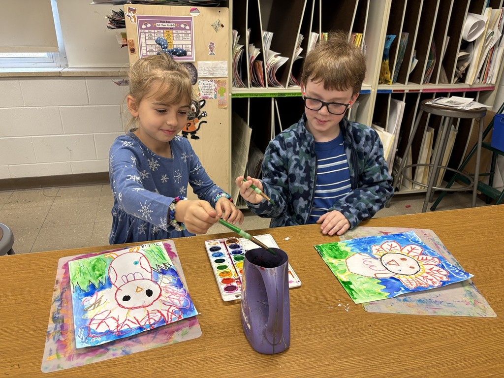 Mrs. Orr art class of 1st graders painting watercolor turkeys