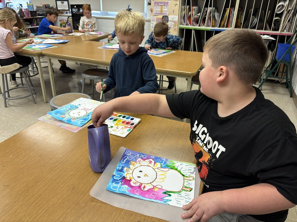 Mrs. Orr art class of 1st graders painting watercolor turkeys