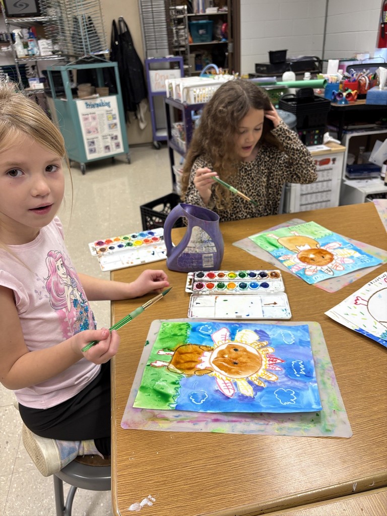 Mrs. Orr art class of 1st graders painting watercolor turkeys