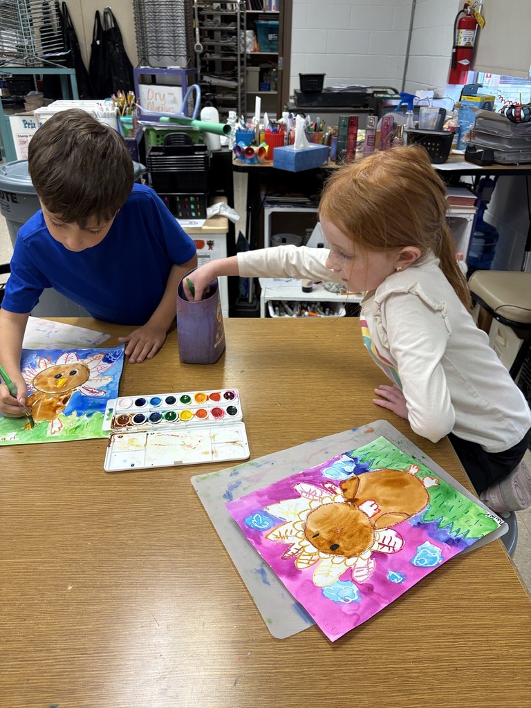 Mrs. Orr art class of 1st graders painting watercolor turkeys