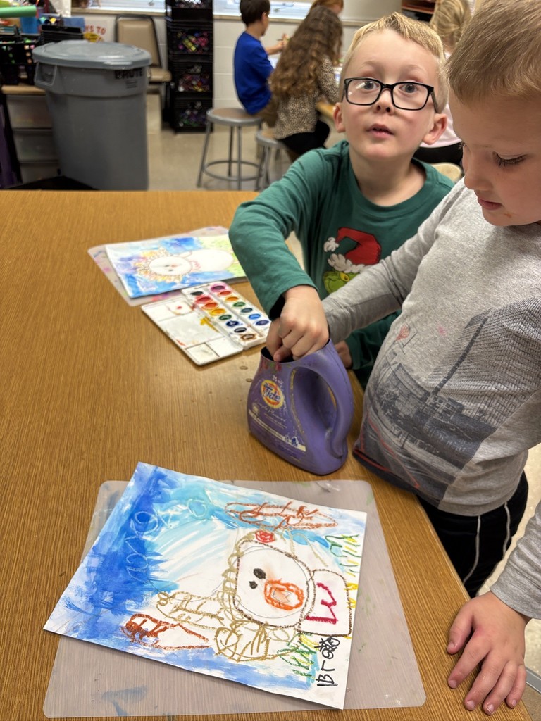 Mrs. Orr art class of 1st graders painting watercolor turkeys