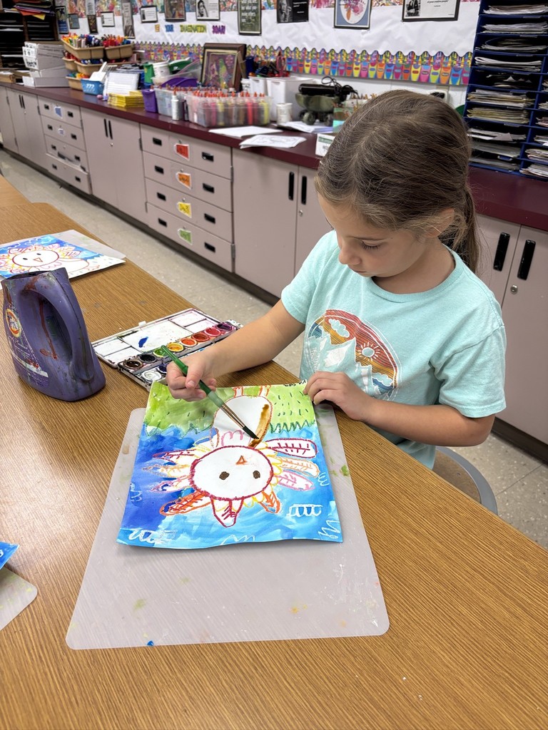 Mrs. Orr art class of 1st graders painting watercolor turkeys