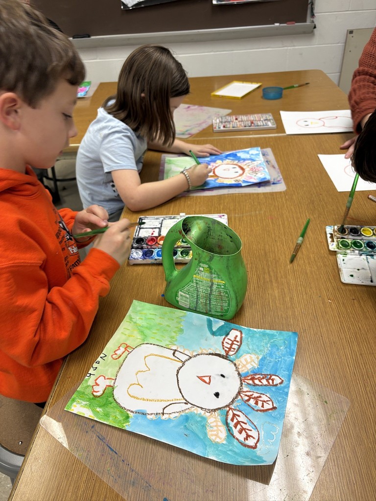 Mrs. Orr art class of 1st graders painting watercolor turkeys