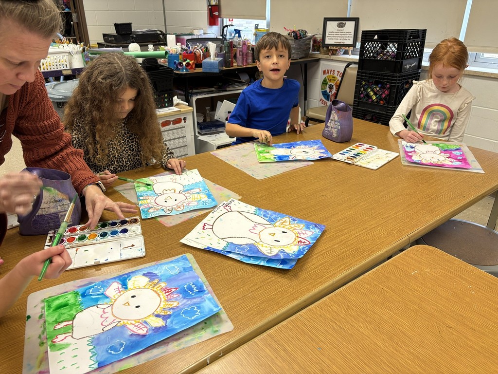 Mrs. Orr art class of 1st graders painting watercolor turkeys