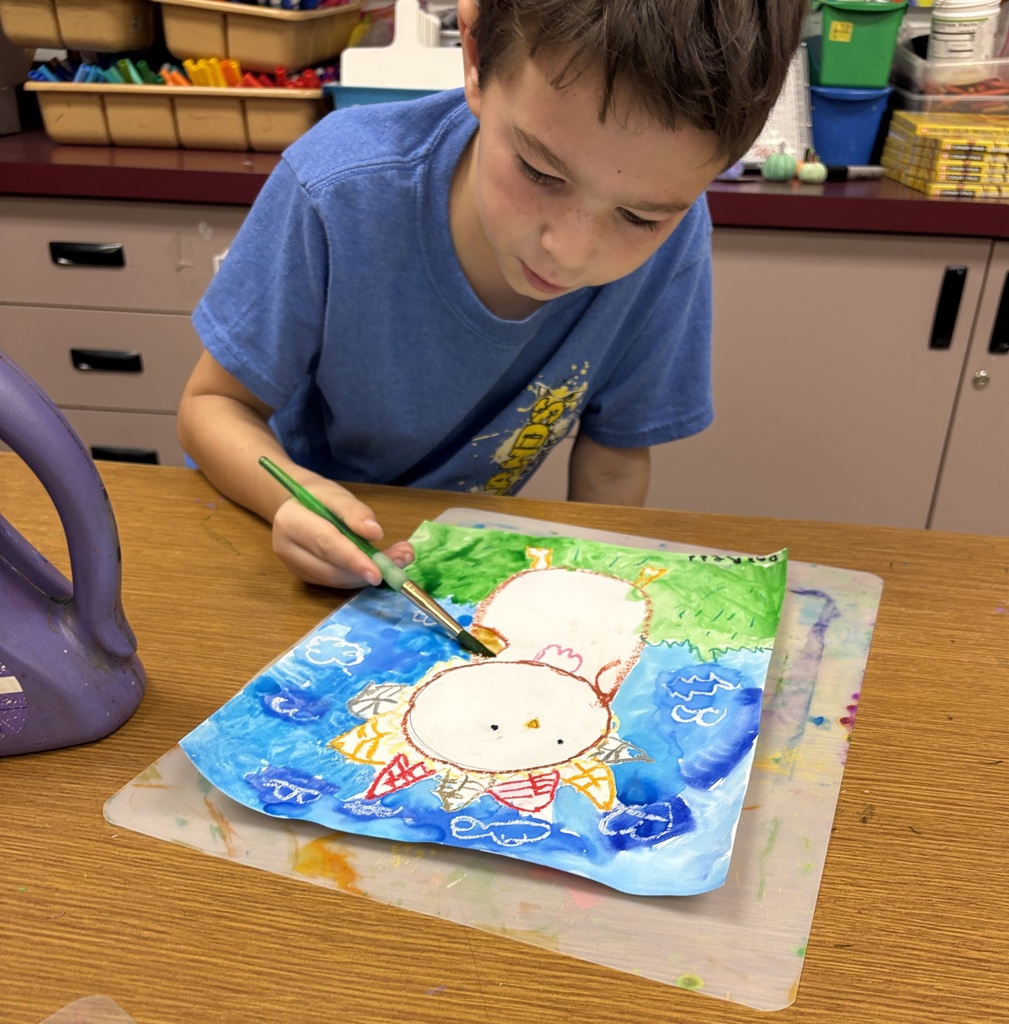 Mrs. Orr art class of 1st graders painting watercolor turkeys