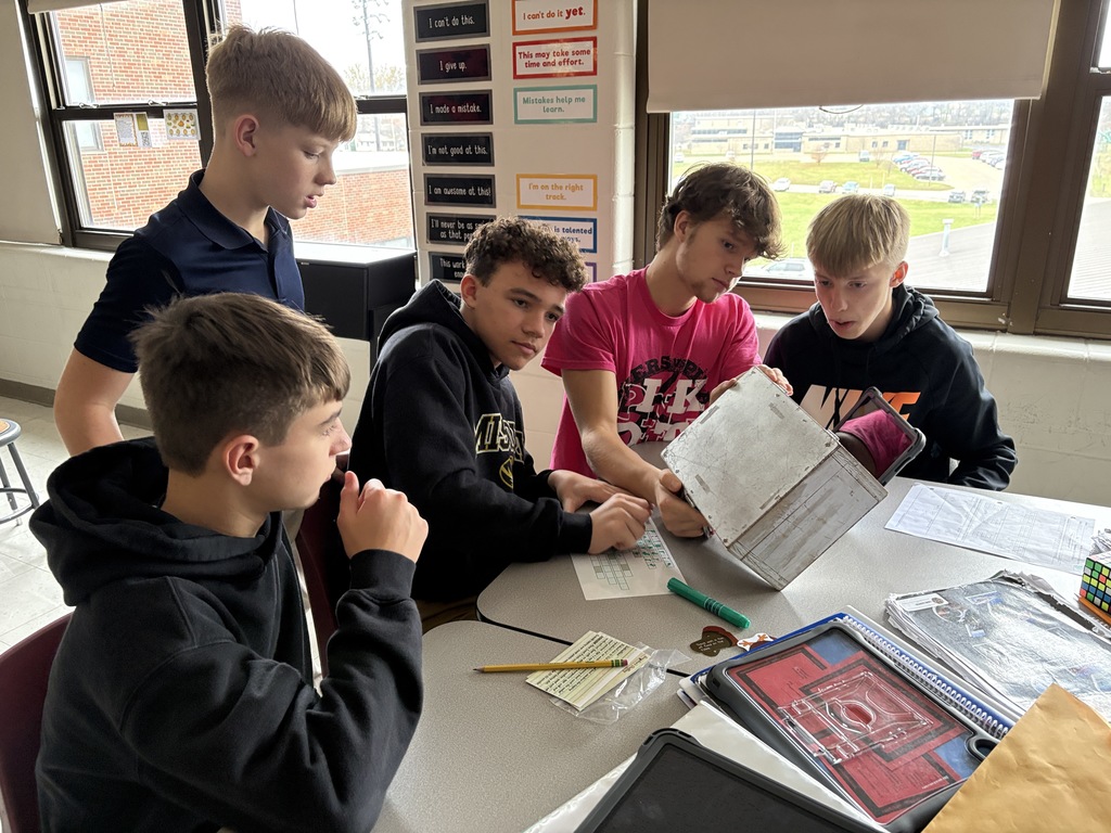 Ms. Morris class used clues to solve puzzles and unlock locks in an escape room like activity