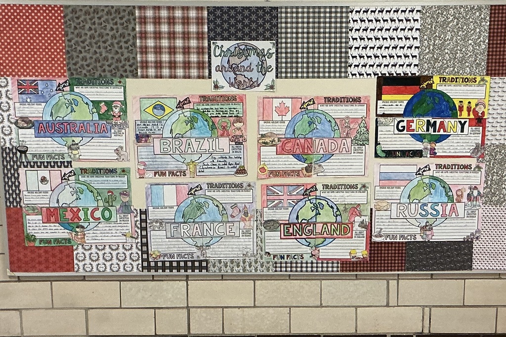 Students in STEM class work on Christmas Around the World display