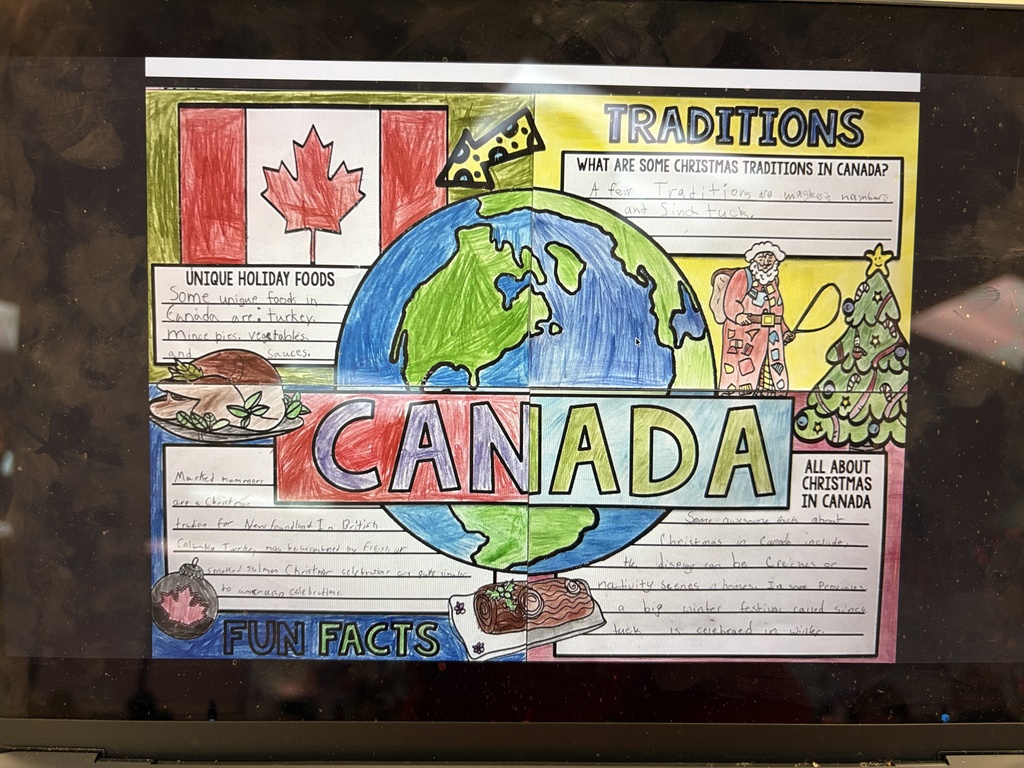 Students in STEM class work on Christmas Around the World display