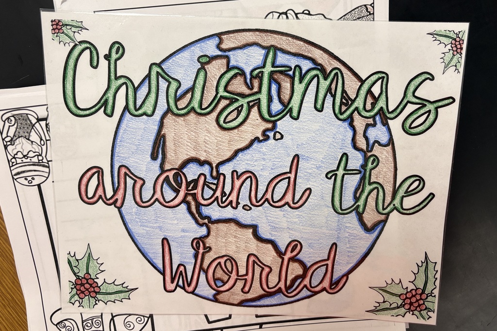 Students in STEM class work on Christmas Around the World display