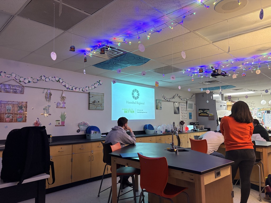 Students performing blood typing lab in science class