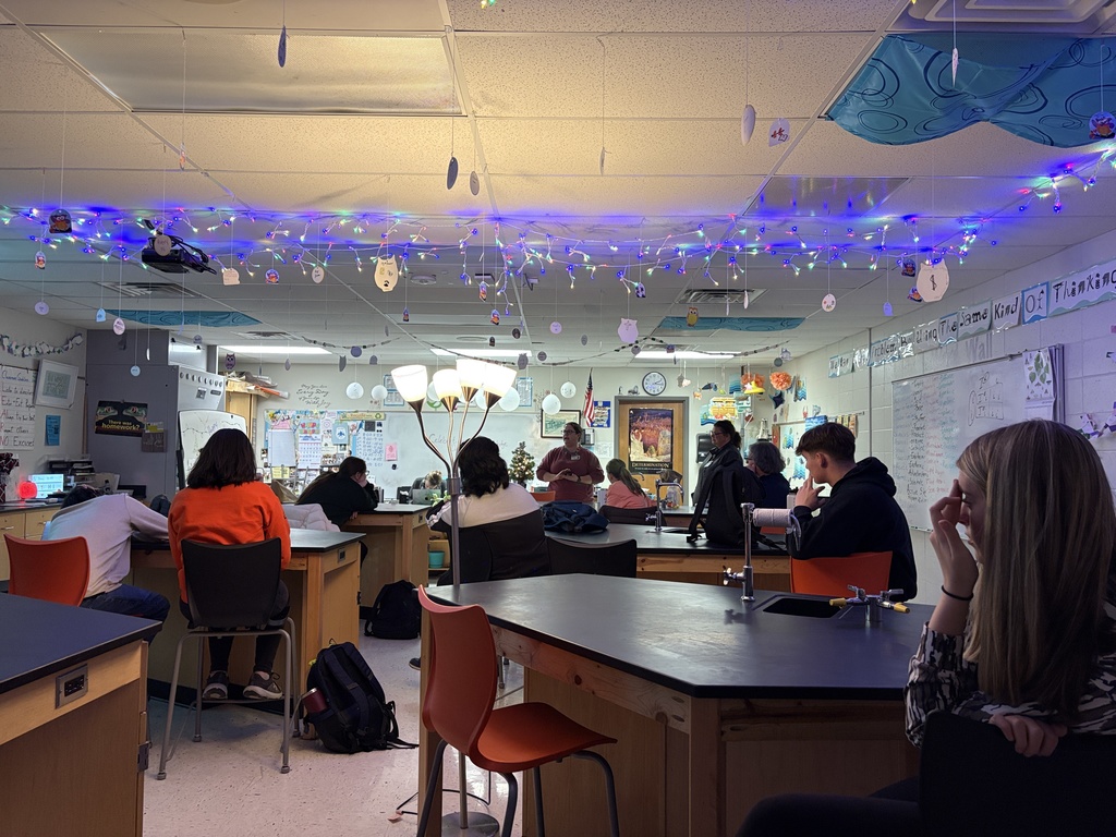 Students performing blood typing lab in science class