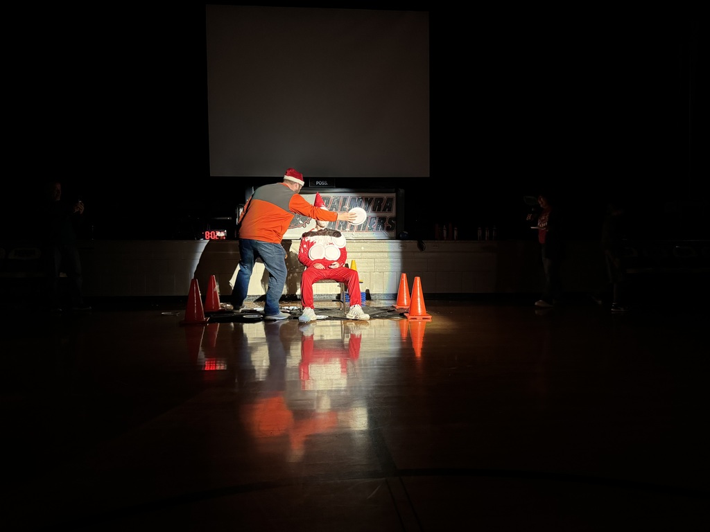 Mr Banta, the elf, being pie'd in the face