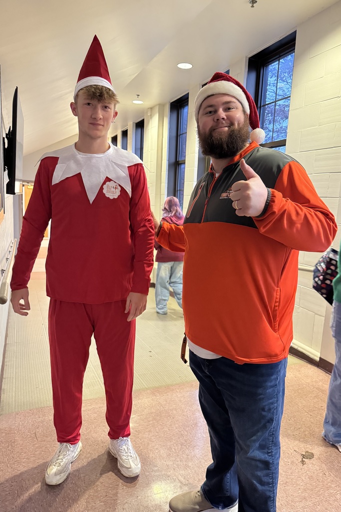 Elf being escorted into the morning assembly